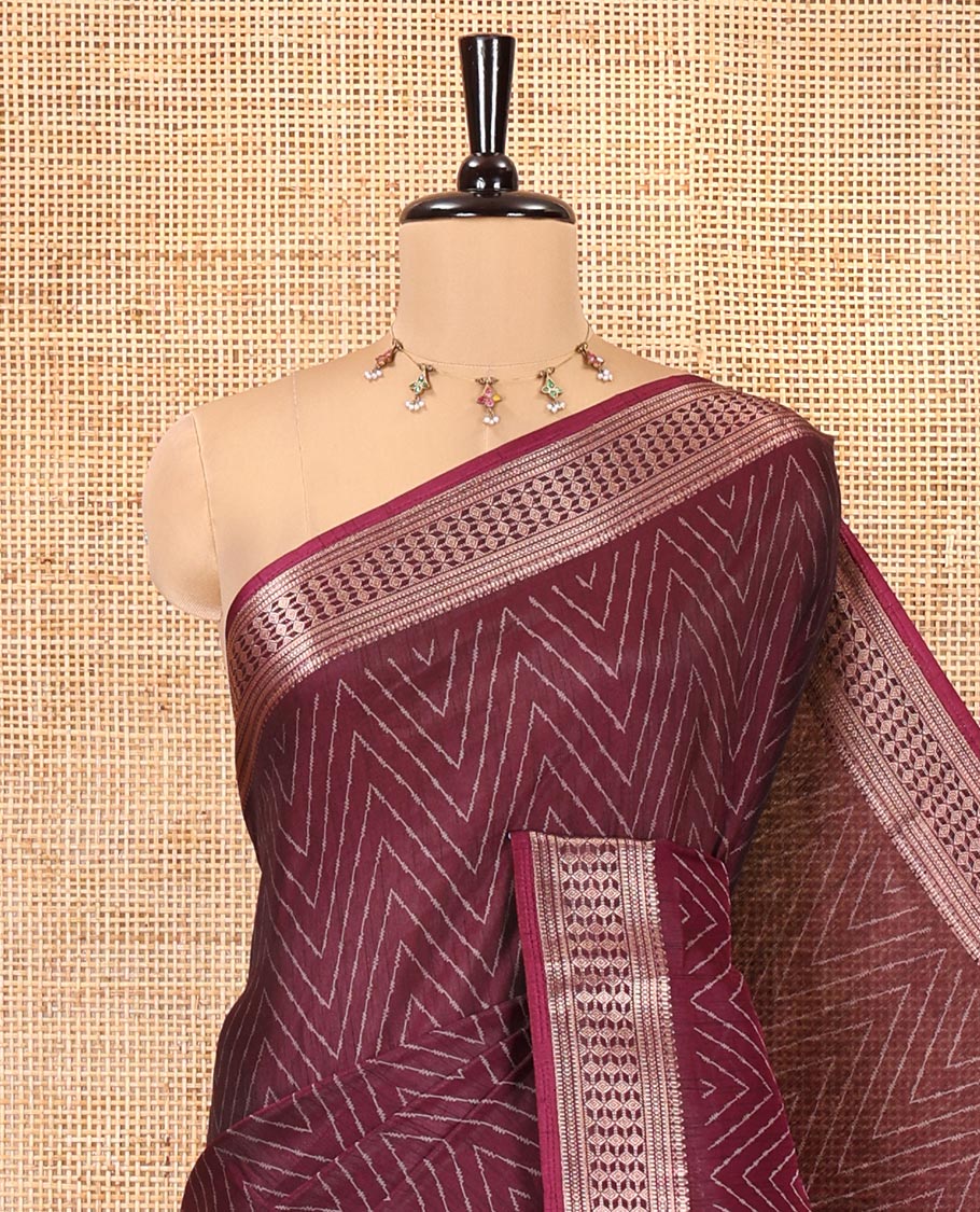 Wine Dola Silk Saree, Subtly Sparkled with Chevron Stripes on Its Body, Highlighted by Traditional Zari Design Border, Intricately Designed Pallu, and Paired with a Matching Blouse
