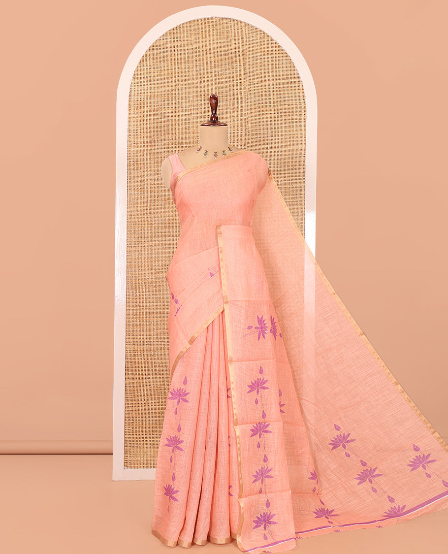 Borderless Peach Linen Cotton Saree Features Lotus Print, a Self-Pallu, and a Matching Blouse
