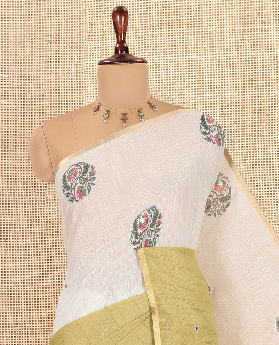 Cream-Green Linen Cotton Saree Features a Half-And-Half-Style Floral Butta and Mirror Work, a Piping Border, a Contrast Blouse
