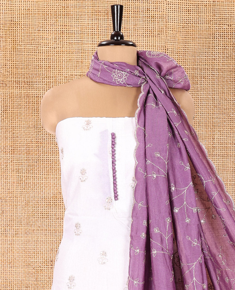 Cream with Lavender Vichitra Silk Material Chudidar Set, Elevated with Gold Zari Buttas On Its Top, a Plain Santoon Bottom, and Comes with a Floral Vine Sequins Embroidered Dupatta