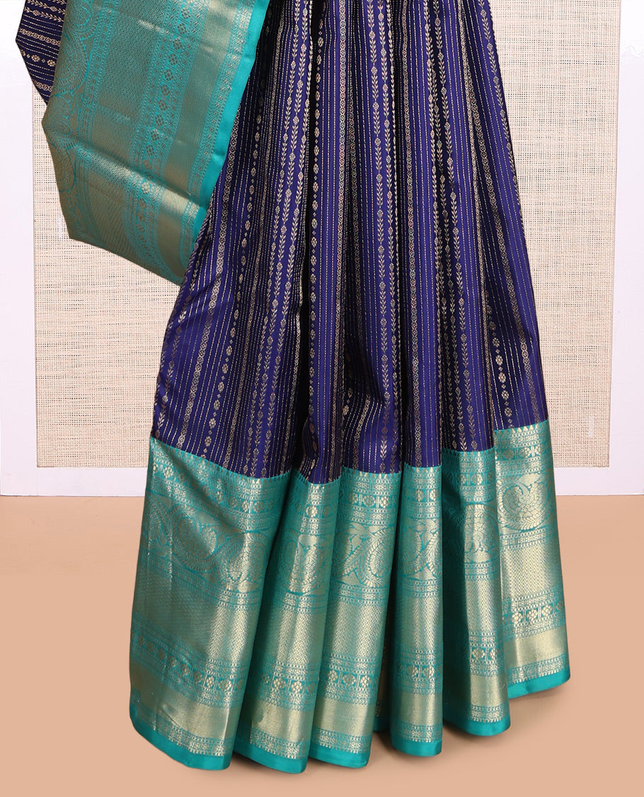 Blue Vasundhara Silk Saree Adorned with Jacquard Design Weave All Over Its Body, Complemented by a Contrast Border of Rekku, Muthu, Laddu Kamalam, Then Kuli Kann, and Dhavana Kodi Designs, Artfully Zari Woven Pallu, and Paired with a Contrast Blouse