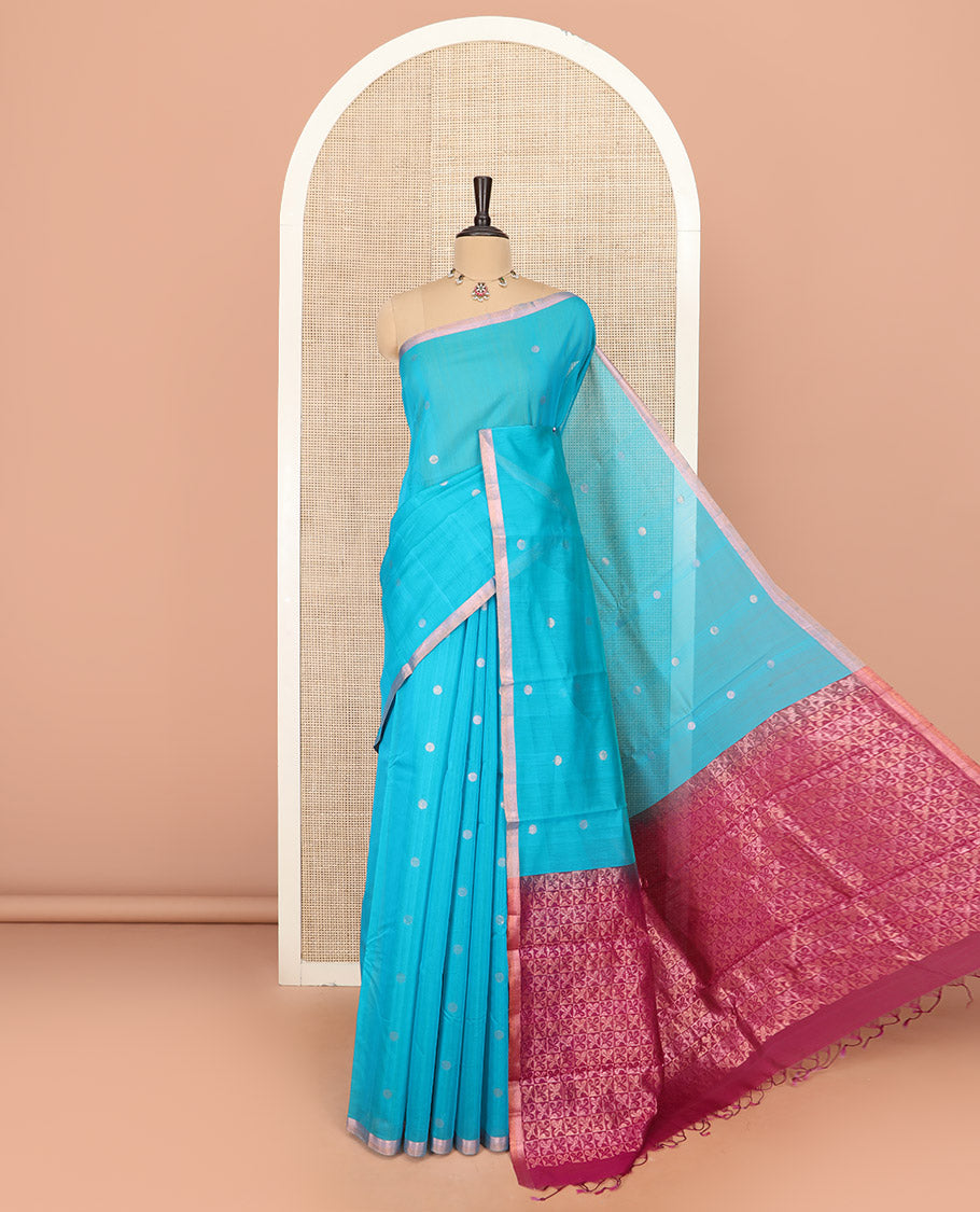 Blue Silk Cotton Saree Woven with Polka Dot Buttas All Over the Body, Subtly Woven Piping Border, Captivating Contrast Pallu of Floral Zari Designs, and Comes with a Contrast Blouse