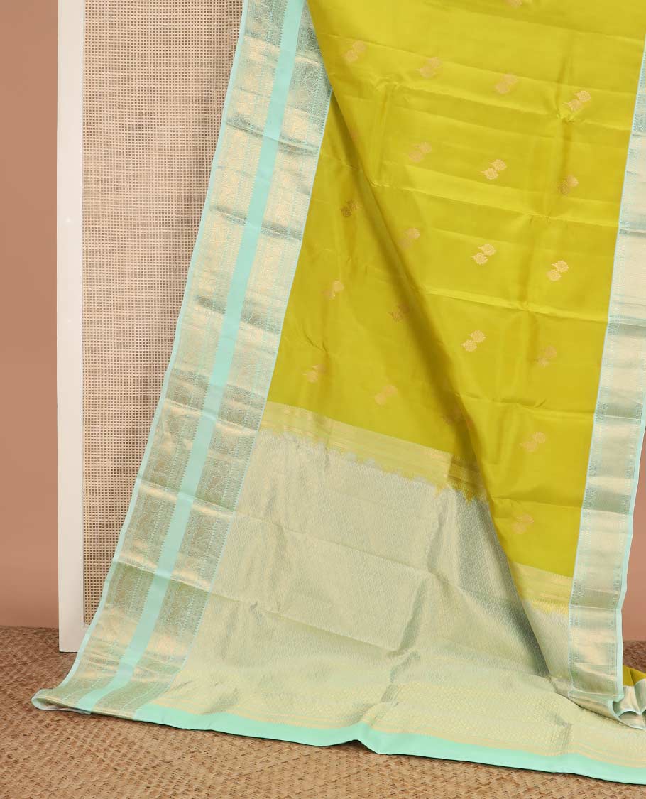 Green zari buttas Vasundhara silk mix saree, contrast rettai pettu border of rekku, rudraksham, and mayil designs and zari rich jaal pallu