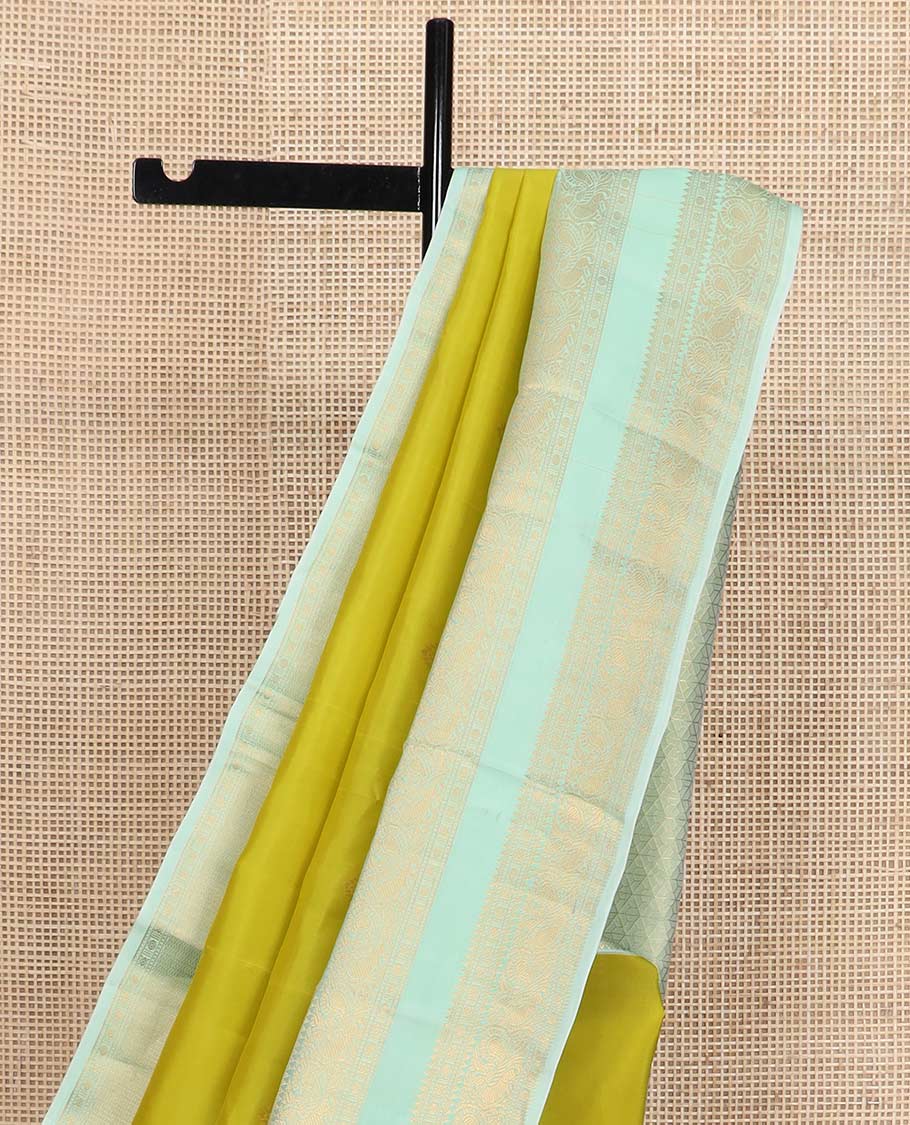 Green zari buttas Vasundhara silk mix saree, contrast rettai pettu border of rekku, rudraksham, and mayil designs and zari rich jaal pallu