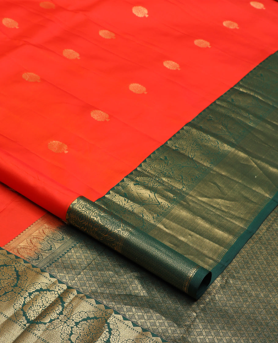Red zari buttas silk saree, contrast border of rekku, iruthalai pakshi, yaanai, and mayil kann designs, and jaal pallu