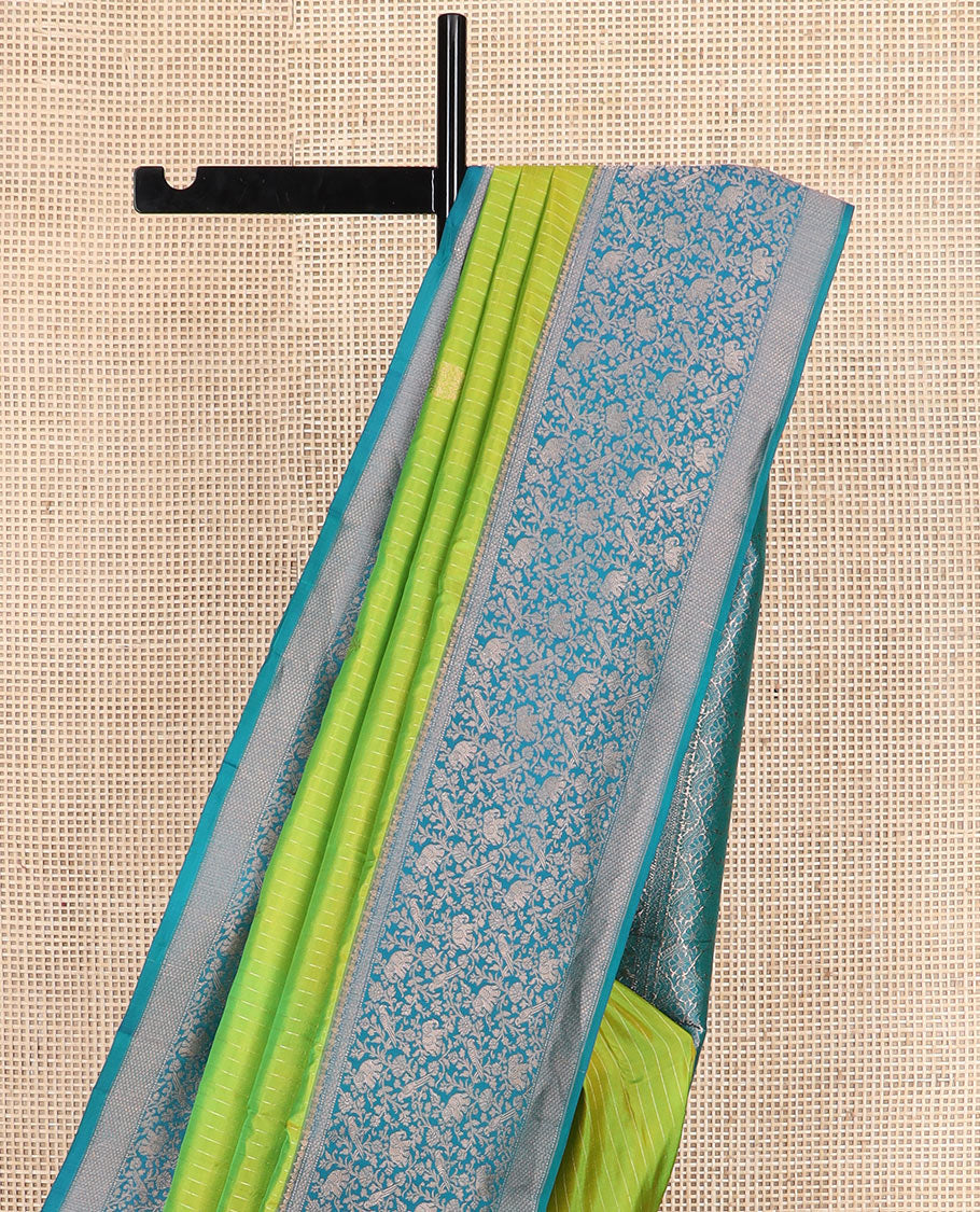 Green striped and zari buttas silk saree with contrast vanasingaram border of yaanai, killi, and kodi visiry designs, and jaal pallu