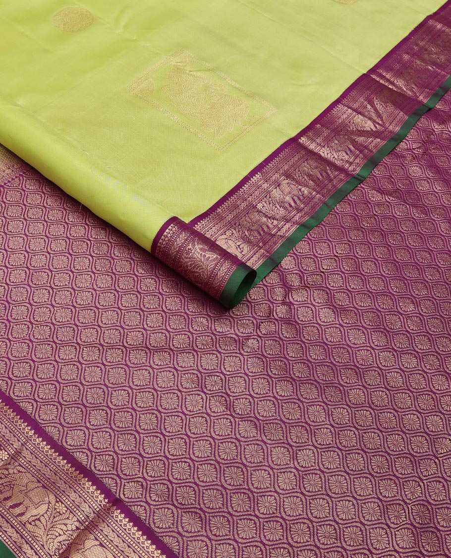 Green silk saree with box mayil and chakram buttas, contrast border of thilakam mokku,muthu,kathir & yaanai designs & jaal pallu
