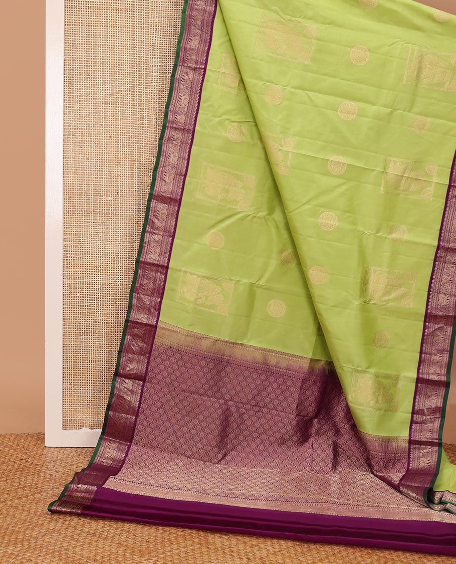 Green silk saree with box mayil and chakram buttas, contrast border of thilakam mokku,muthu,kathir & yaanai designs & jaal pallu