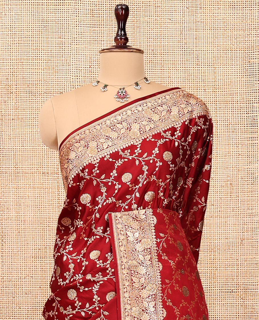 Red Banarasi Satin Saree, Gracefully Embellished with Floral Jaal Jacquard, a Floral Creeper Border, Intricate Stonework Pallu, and a Matching Blouse