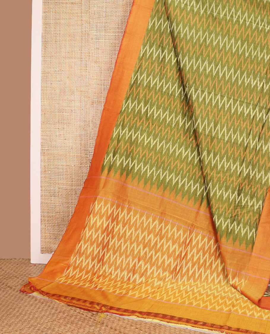 Green chevron striped ikkat cotton saree, contrast plain border, and chevron design pallu