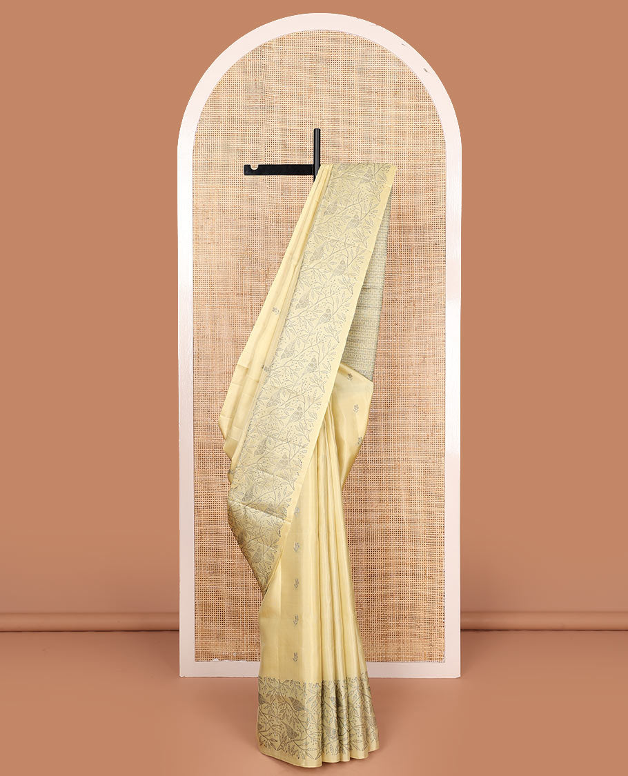 Pastel yellow floral buttas soft silk saree, floral-bird design border, and intricately designed pallu