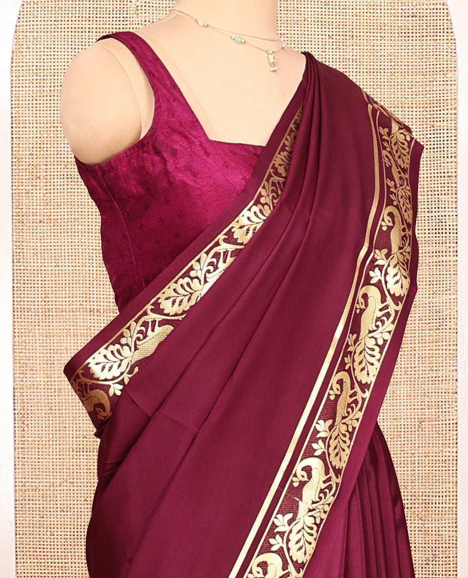 Maroon Plain Mysore Silk Saree, Highlighted by Zari Traditional Border of Peacock Designs, Pallu Steeped with Zari Stripes, and Paired with a Matching Blouse