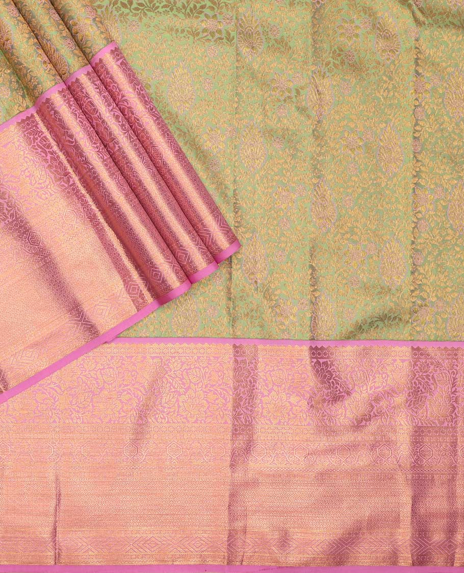 Green pure-silk half saree, jacquard with contrast traditional zari bordered skirt, blouse of rekku, kodi visiry, paisa, diamond, and then kuli kann, and zari design dhavani