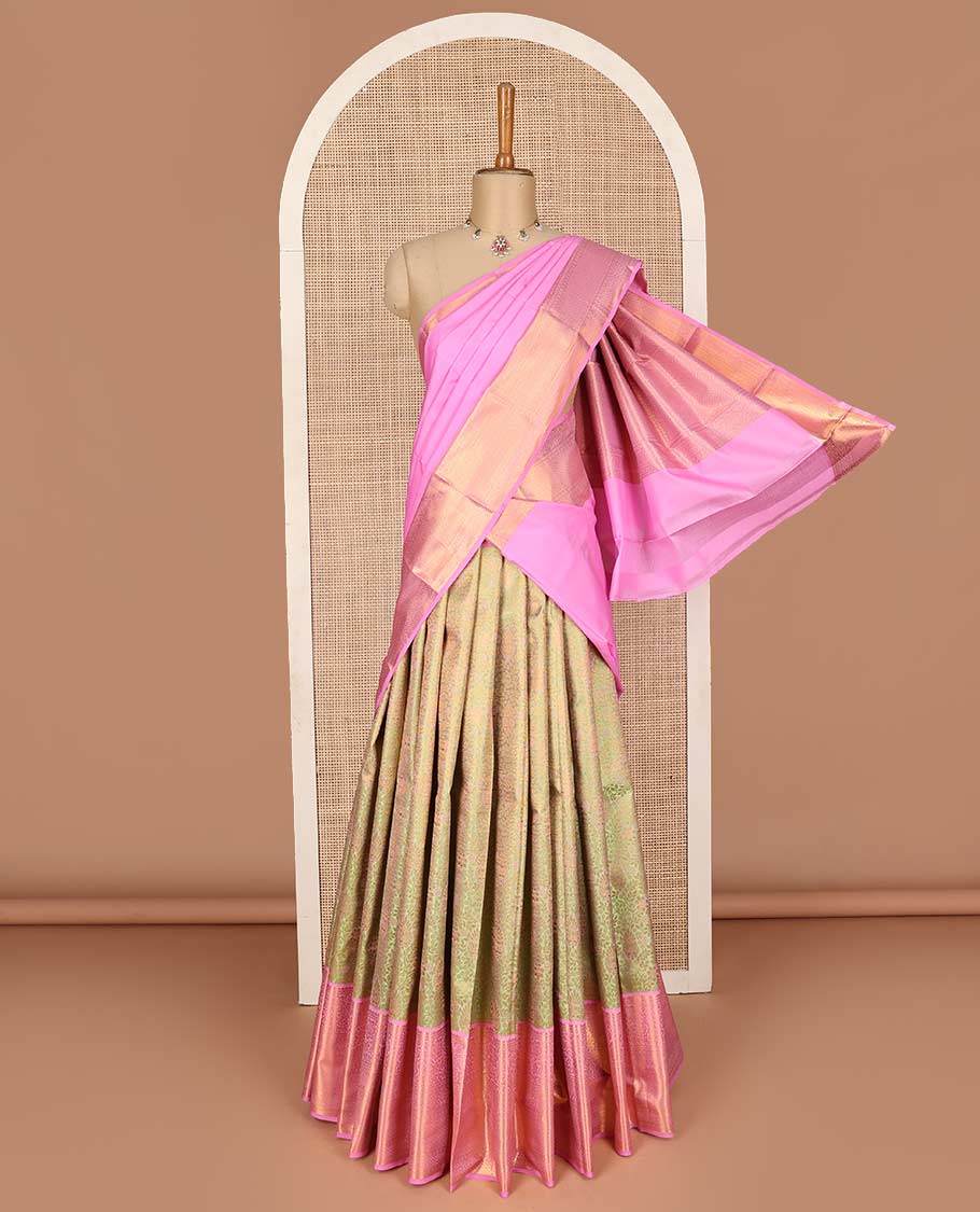 Green pure-silk half saree, jacquard with contrast traditional zari bordered skirt, blouse of rekku, kodi visiry, paisa, diamond, and then kuli kann, and zari design dhavani