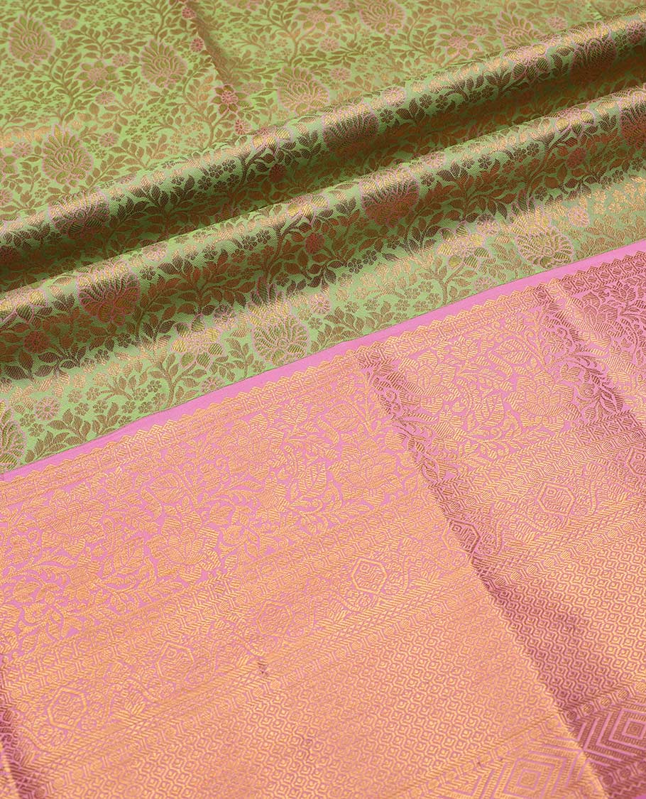 Green pure-silk half saree, jacquard with contrast traditional zari bordered skirt, blouse of rekku, kodi visiry, paisa, diamond, and then kuli kann, and zari design dhavani