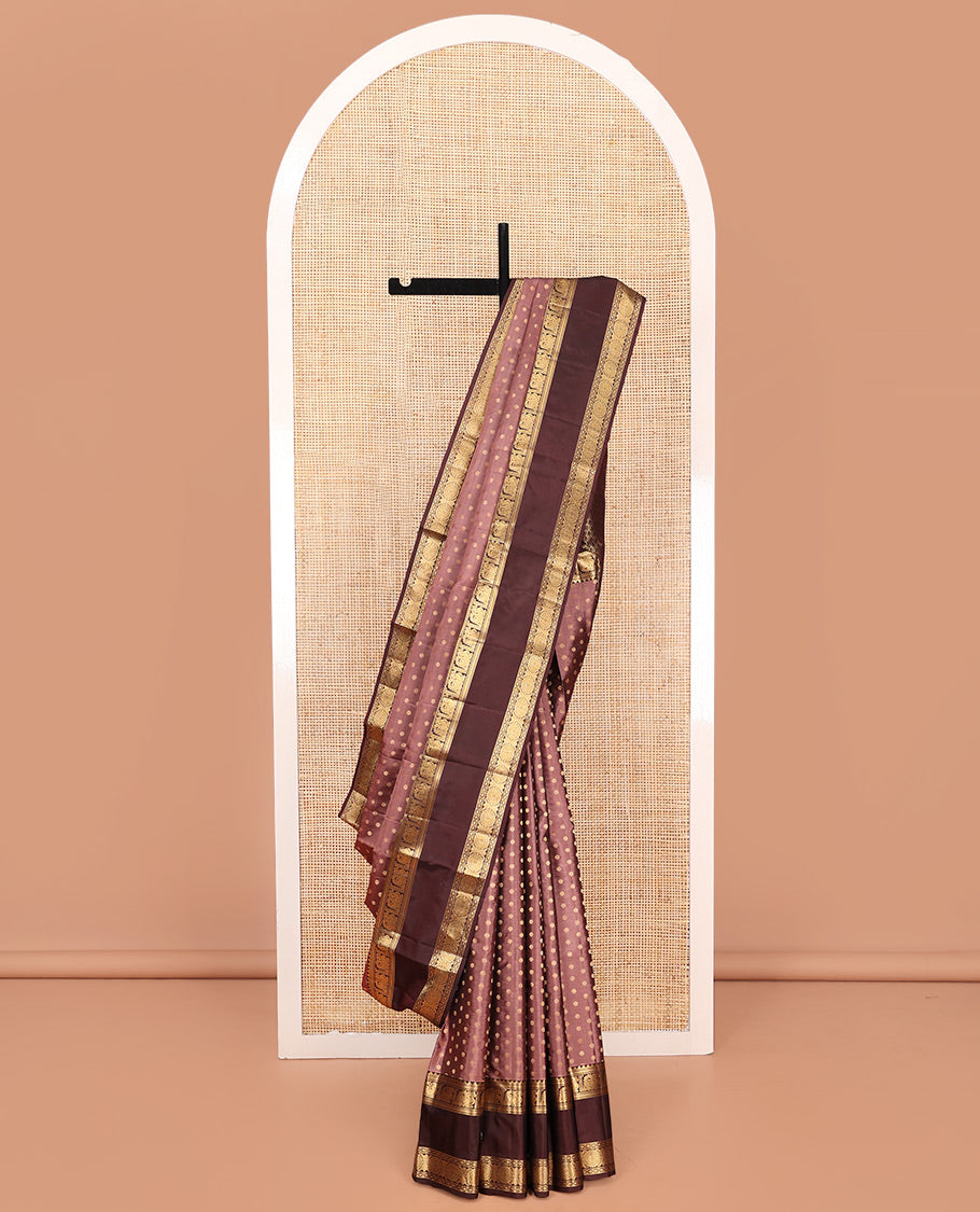 Brown Vasundhara Silk Saree, Beautified with Floral Buttas on Its Body, Complemented by a Contrast Rettai Pettu Border of Rekku, Kathir, Annam Lavangam, and Cross Kamalam Designs, Pallu of Jaal Designs, and Paired with a Contrast Blouse