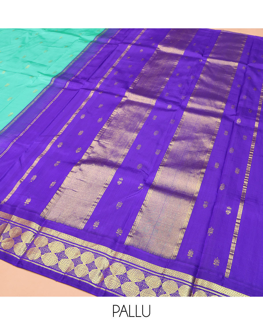 Turquoise Kanchipuram Silk Saree, Beautified with Zari Buttas on Its Body, Complemented by a Contrast One-Sided Korvai Border of Vanki, Banaras, and Rudraksham Designs, Pallu of Zari Designs, and Comes Without a Blouse