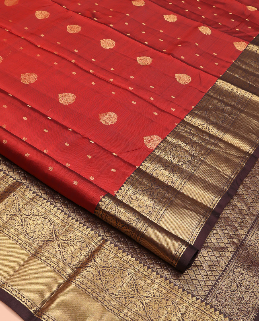 Maroon Vasundhara Silk Saree, Decked Up with Zari Buttas All Over Its Body, Complemented by Contrast Border of Rekku Poun, Muthu, and Floral Designs, Grand Jaal Pallu and Paired with a Contrast Blouse