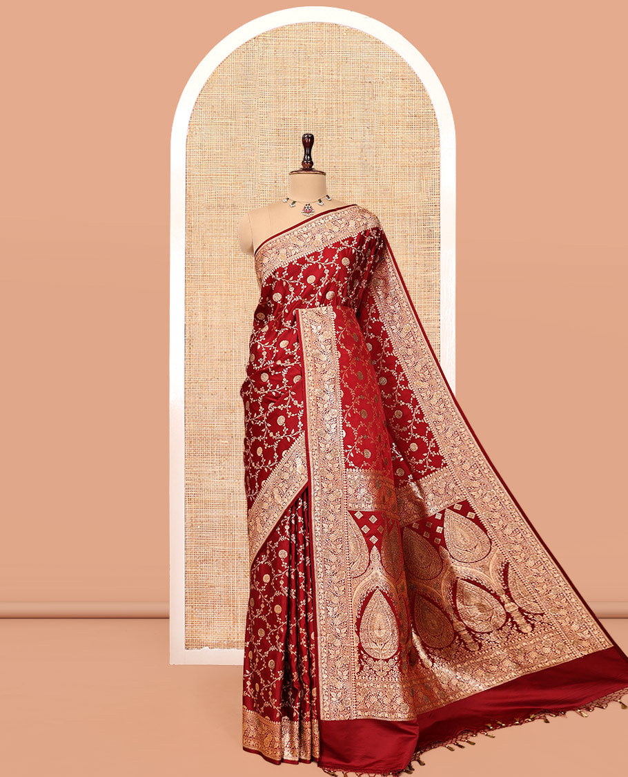 Red Banarasi Satin Saree, Gracefully Embellished with Floral Jaal Jacquard, a Floral Creeper Border, Intricate Stonework Pallu, and a Matching Blouse
