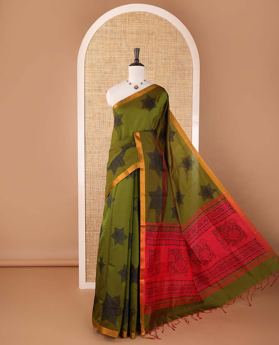Olive green six-petal-like leaf motifs printed micro-silk saree, copper zari border, contrast intricate pallu & plain red blouse