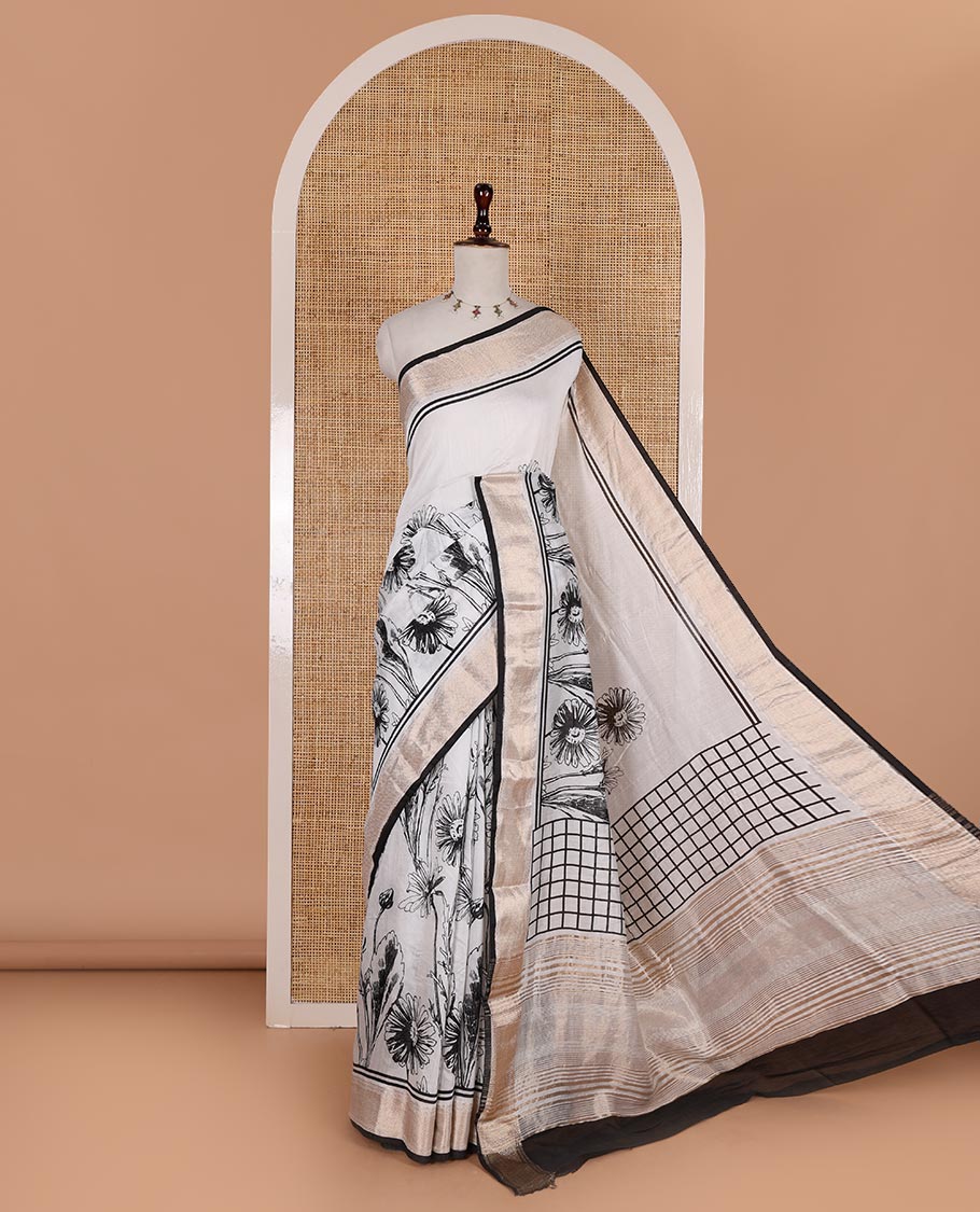 White sunflower floral printed assam cotton saree, zari border of traditional motifs, striped pallu, and contrast blouse