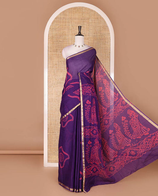 Purple batik geometric printed pure cotton saree, zari piping border, human figurines batik printed pallu, and a matching batik printed blouse