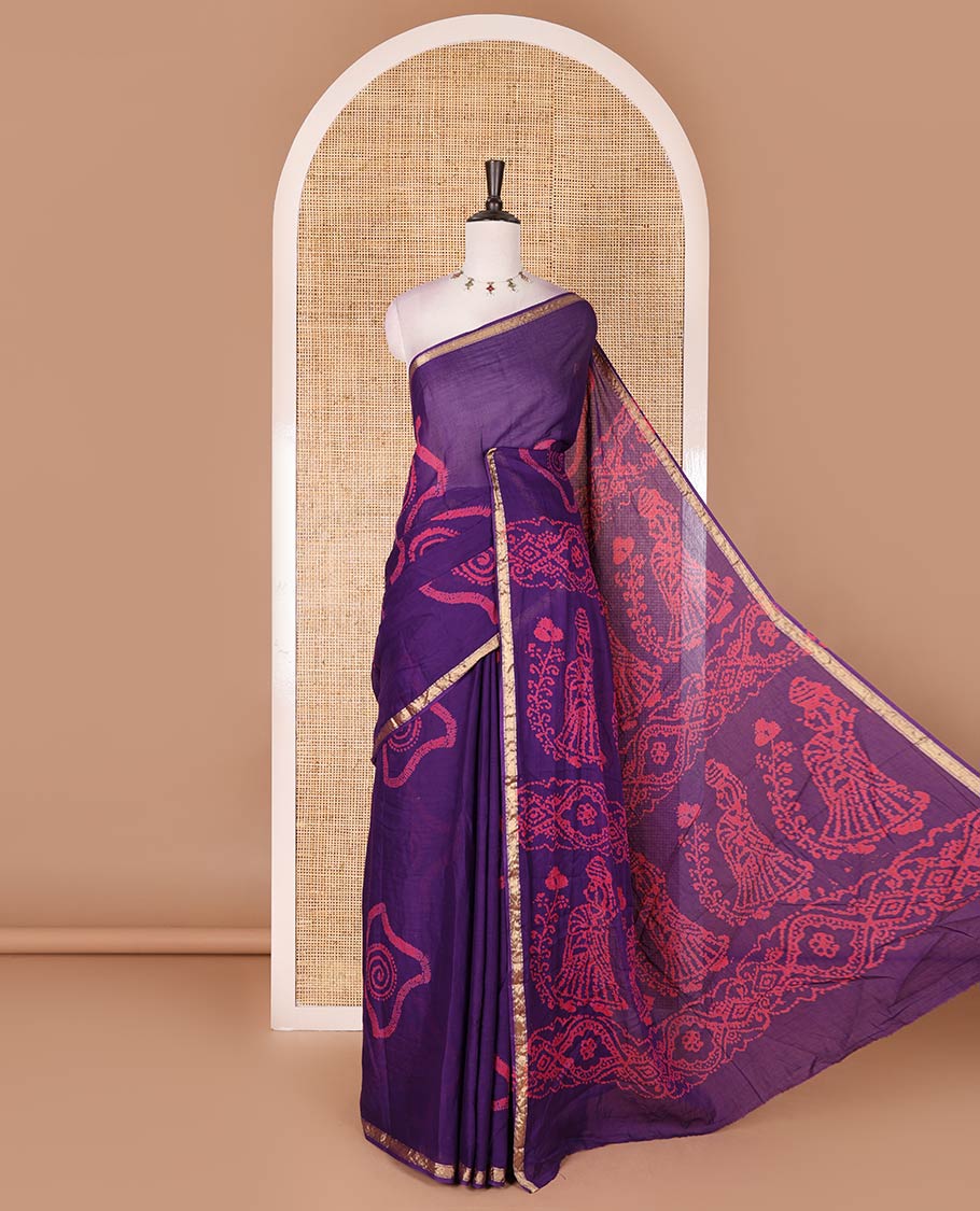 Purple batik geometric printed pure cotton saree, zari piping border, human figurines batik printed pallu, and a matching batik printed blouse