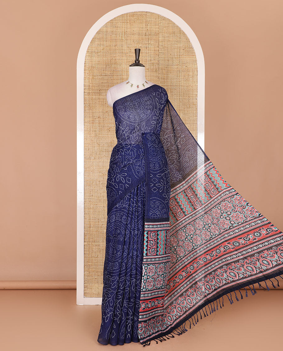 Borderless blue bandhani style floral, paisley, and chakra printed semi-jute silk saree, contrast ajrakh printed pallu, and ajrakh printed blouse
