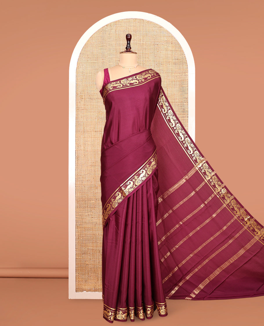 Maroon Plain Mysore Silk Saree, Highlighted by Zari Traditional Border of Peacock Designs, Pallu Steeped with Zari Stripes, and Paired with a Matching Blouse