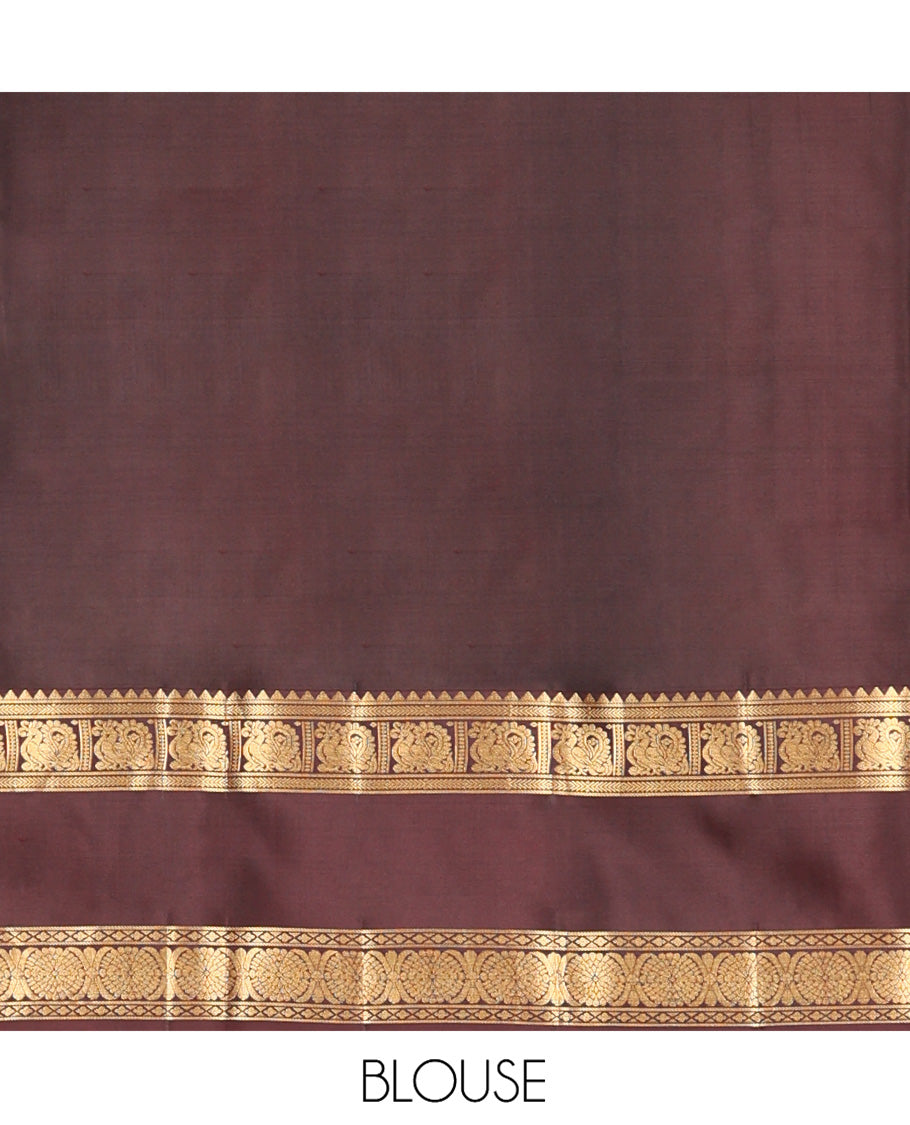 Brown Vasundhara Silk Saree, Beautified with Floral Buttas on Its Body, Complemented by a Contrast Rettai Pettu Border of Rekku, Kathir, Annam Lavangam, and Cross Kamalam Designs, Pallu of Jaal Designs, and Paired with a Contrast Blouse