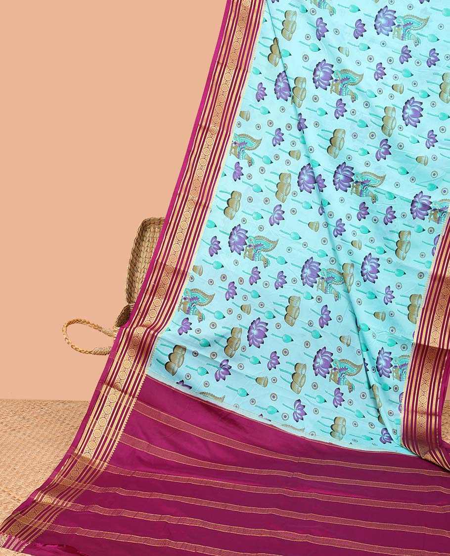 Blue kalamkari-style lotus & peacock semi-banaras printed saree, contrast traditional design border & striped pallu