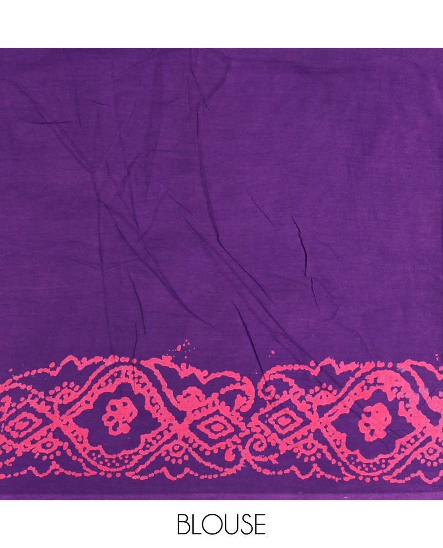 Purple batik geometric printed pure cotton saree, zari piping border, human figurines batik printed pallu, and a matching batik printed blouse