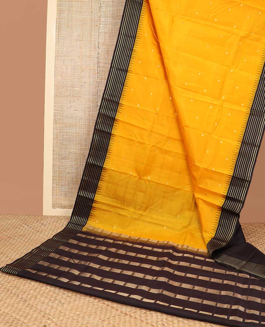 Yellow buttas silk saree with contrast border of rekku, banaras design & striped pallu
