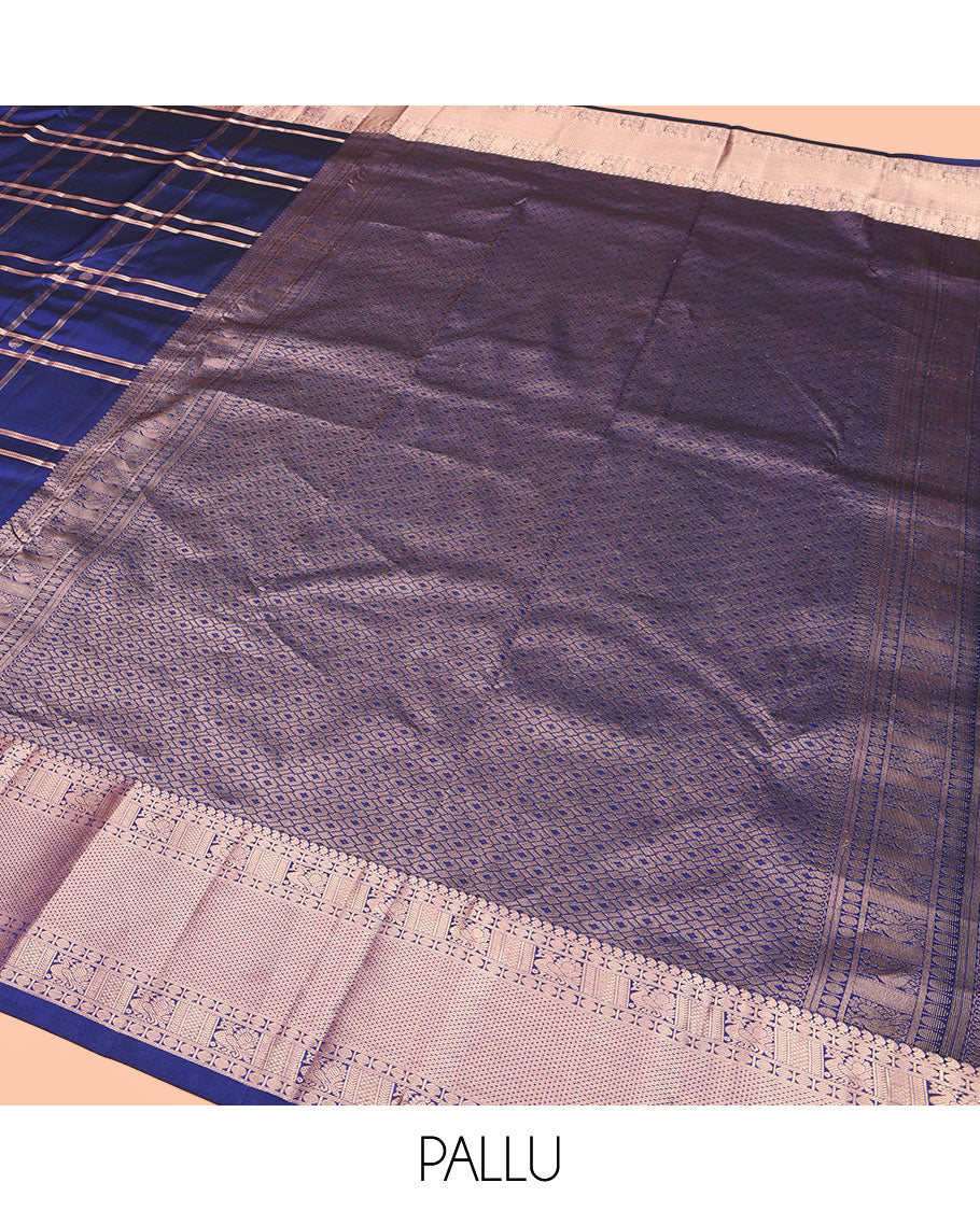 Blue Kanchipuram Silk Saree, Delicately Woven with Zari Buttas and Checked Design All Over Its Body, Highlighted by Zari Border of Manga Mokku, Paisa, Mayil, and Mayil Kann Designs, a Grand Jaal Pallu, and Paired with a Matching Blouse