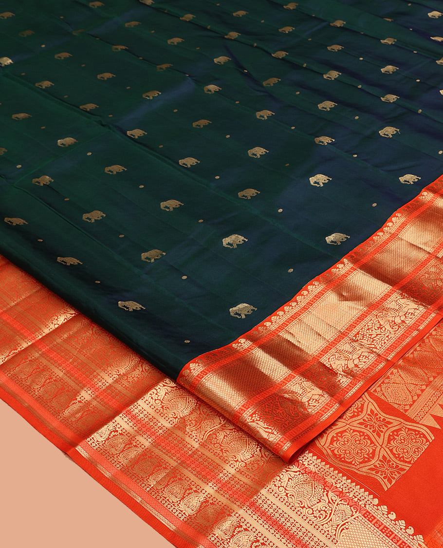 Blue Vasundhara Silk Saree, Embellished with Zari Buttas All Over Its Body, Complemented by a Contrast Border of Kuyil Kann, and Yaanai Designs, Grand Jaal Pallu, and Paired with a Contrast Blouse