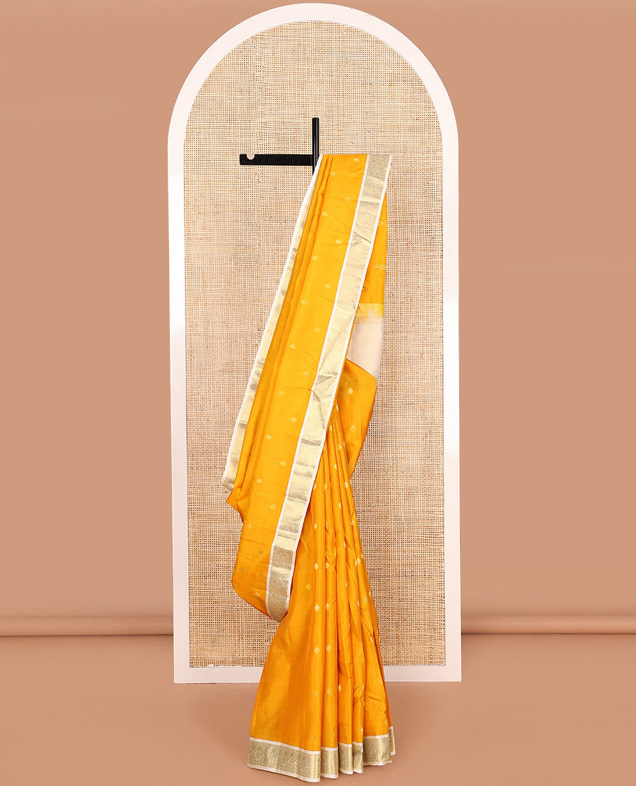 Yellow zari buttas Vasundhara silk mix saree, contrast border of rudraksham and mayil designs, and zari-rich pallu