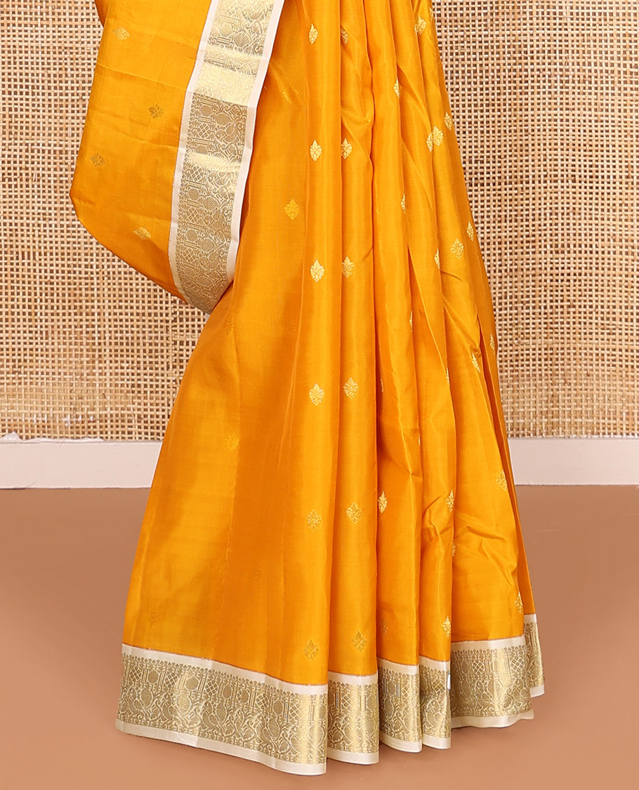 Yellow zari buttas Vasundhara silk mix saree, contrast border of rudraksham and mayil designs, and zari-rich pallu