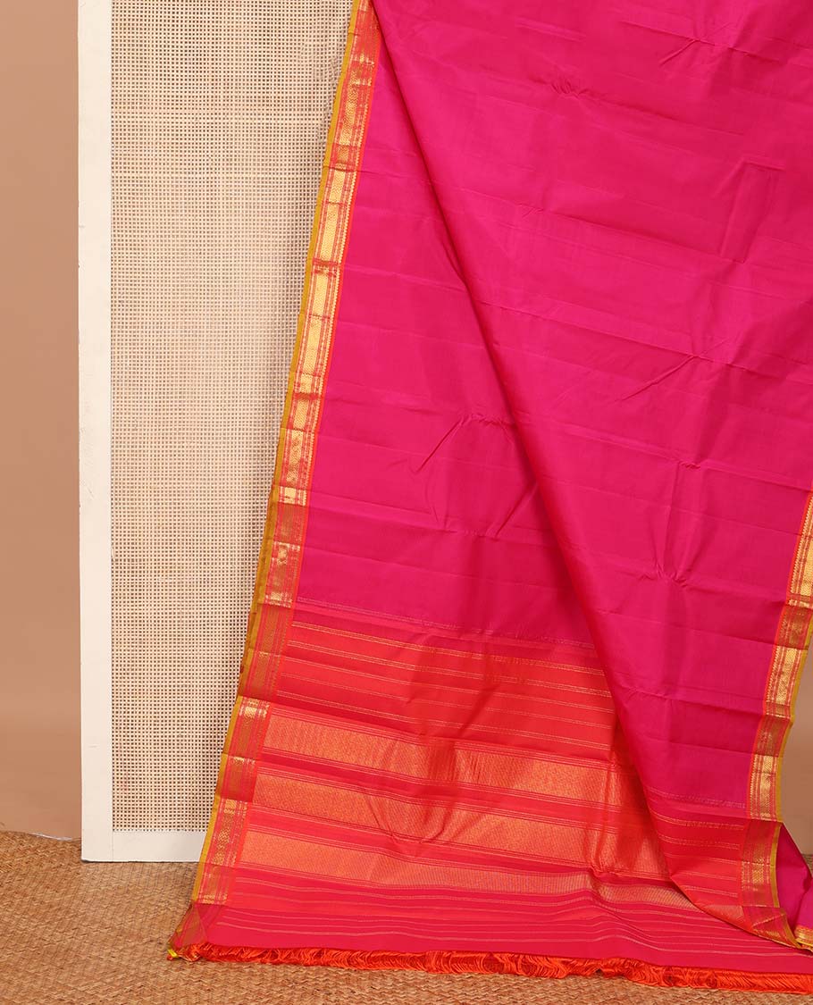 Pink plain Kanchipuram silk saree, contrast border of salngai, muthu, cross kamalam, and vanki designs, and zari design pallu