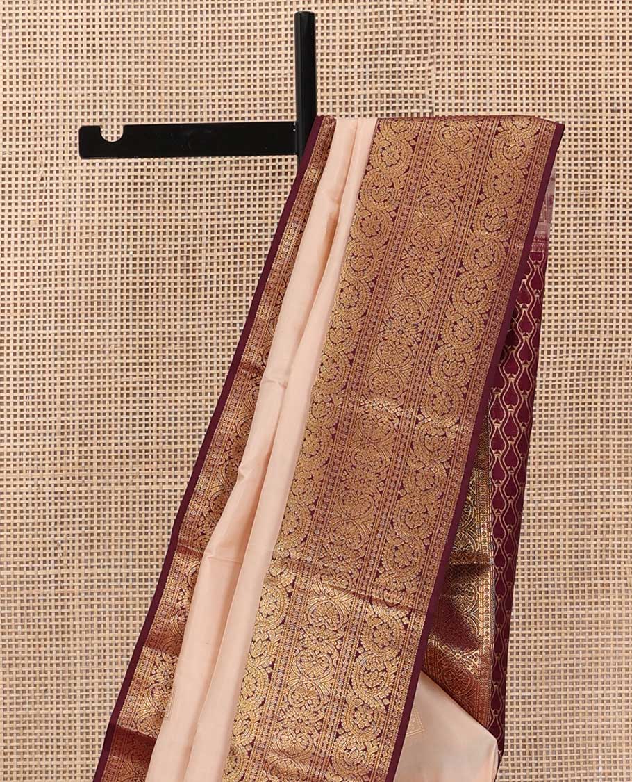 Sandal zari buttas silk saree, contrast border of ara bogudi, jadai nagam, and dhavana kodi, and spade motifs steeped pallu
