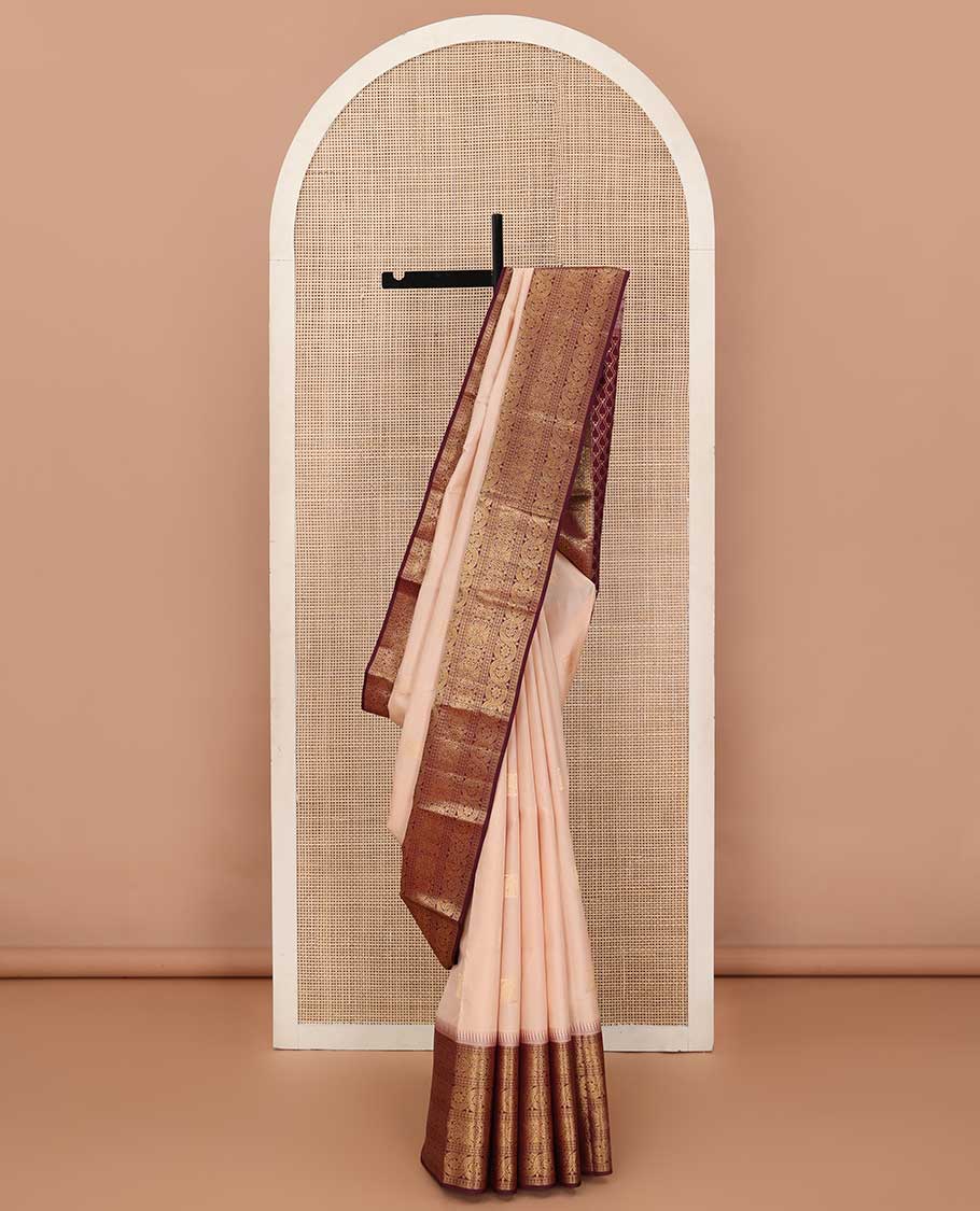 Sandal zari buttas silk saree, contrast border of ara bogudi, jadai nagam, and dhavana kodi, and spade motifs steeped pallu