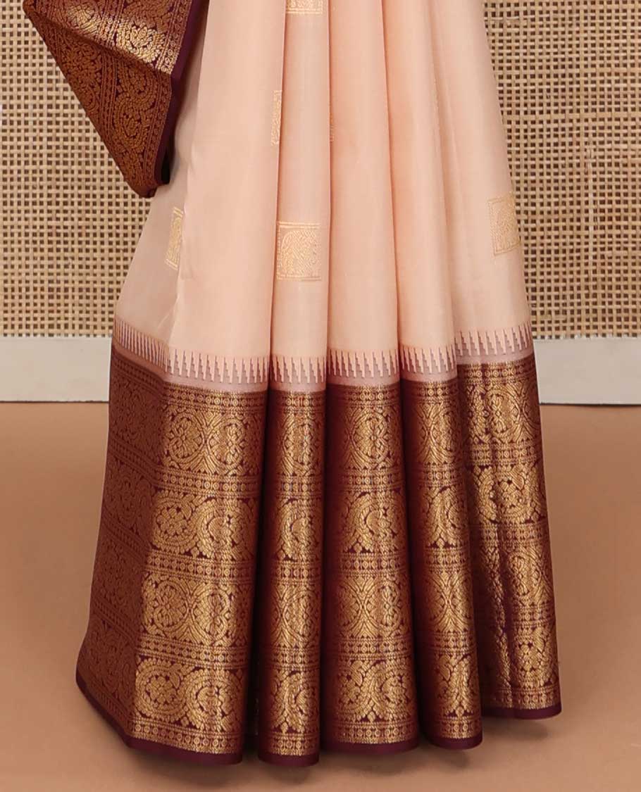 Sandal zari buttas silk saree, contrast border of ara bogudi, jadai nagam, and dhavana kodi, and spade motifs steeped pallu