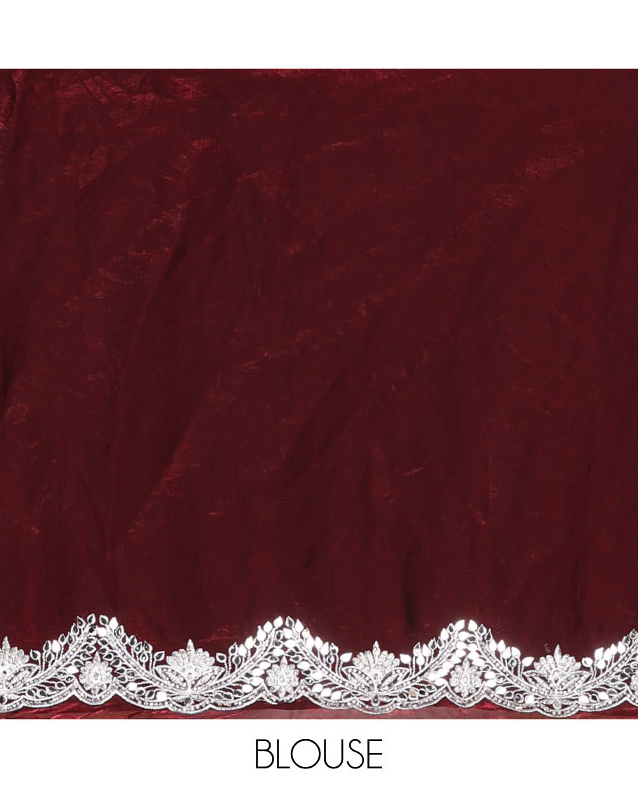Maroon intricate path embroidered motifs featured designer saree, scallop gleaming stone embroidered border