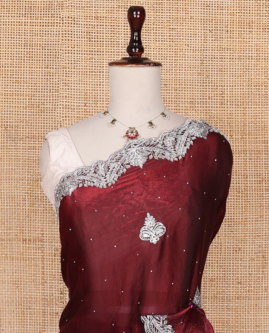 Maroon intricate path embroidered motifs featured designer saree, scallop gleaming stone embroidered border