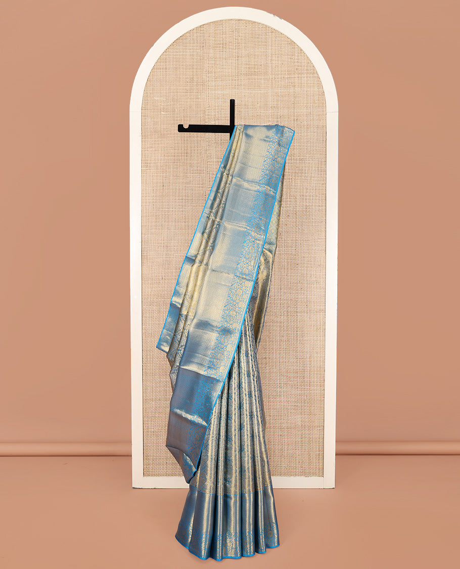 Blue Kanchipuram Silk Saree, Mesmerized with Zari Jacquard Design All Over Its Body, Highlighted by a Zari Border of Thilakam, Muthu, Kathir, Diamond, and Floral Designs, and Pallu of Jaal Designs, and Paired with a Matching Blouse