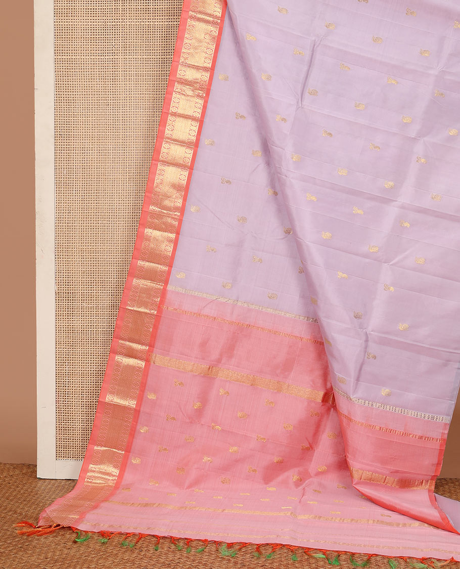 Pastel purple zari buttas Kanchipuram silk saree, contrast one-sided border of laddu kamalam, banras, and mayil kann, and zari design pallu