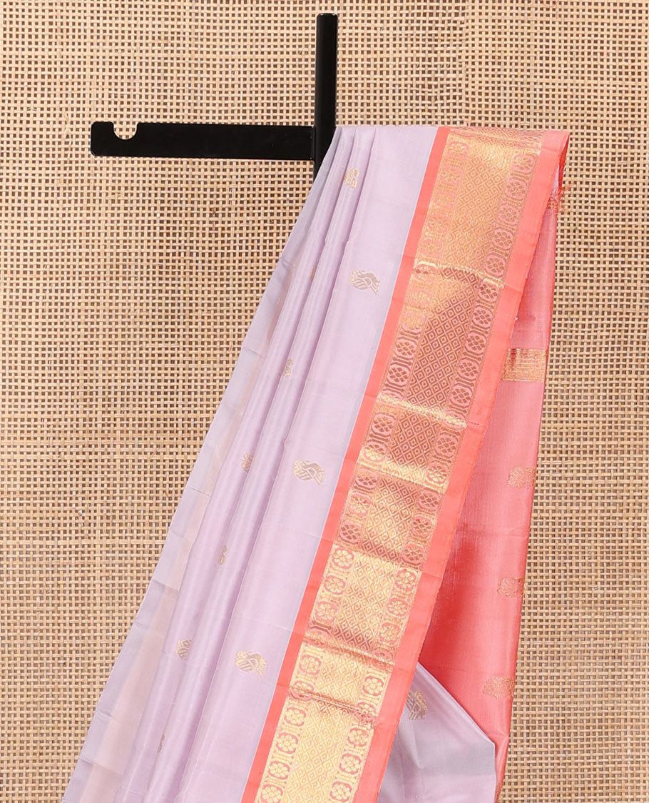 Pastel purple zari buttas Kanchipuram silk saree, contrast one-sided border of laddu kamalam, banras, and mayil kann, and zari design pallu