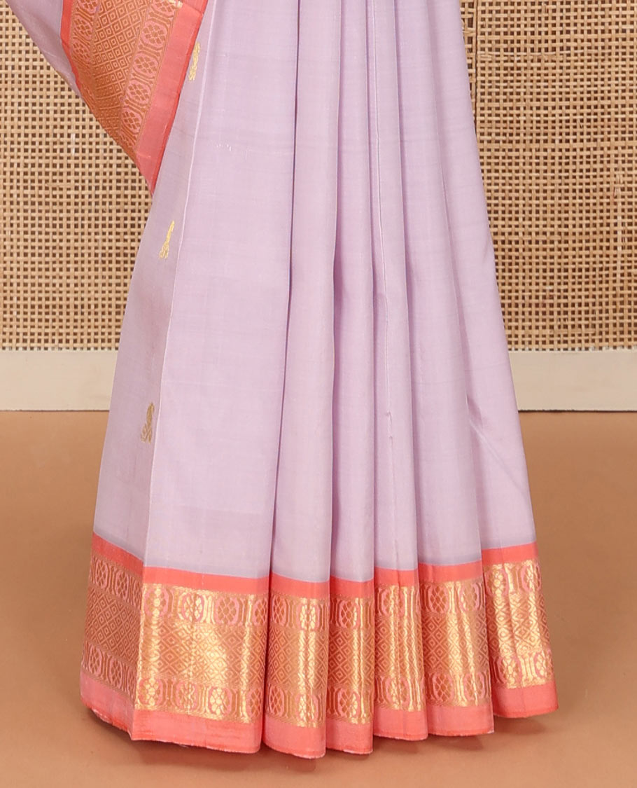 Pastel purple zari buttas Kanchipuram silk saree, contrast one-sided border of laddu kamalam, banras, and mayil kann, and zari design pallu