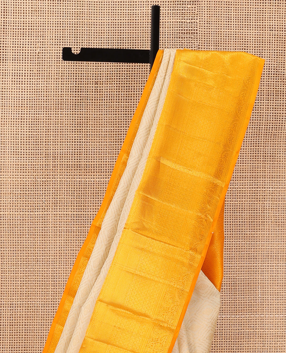 Cream jacquard wedding silk saree, contrast traditional zari design border, and intricate pallu