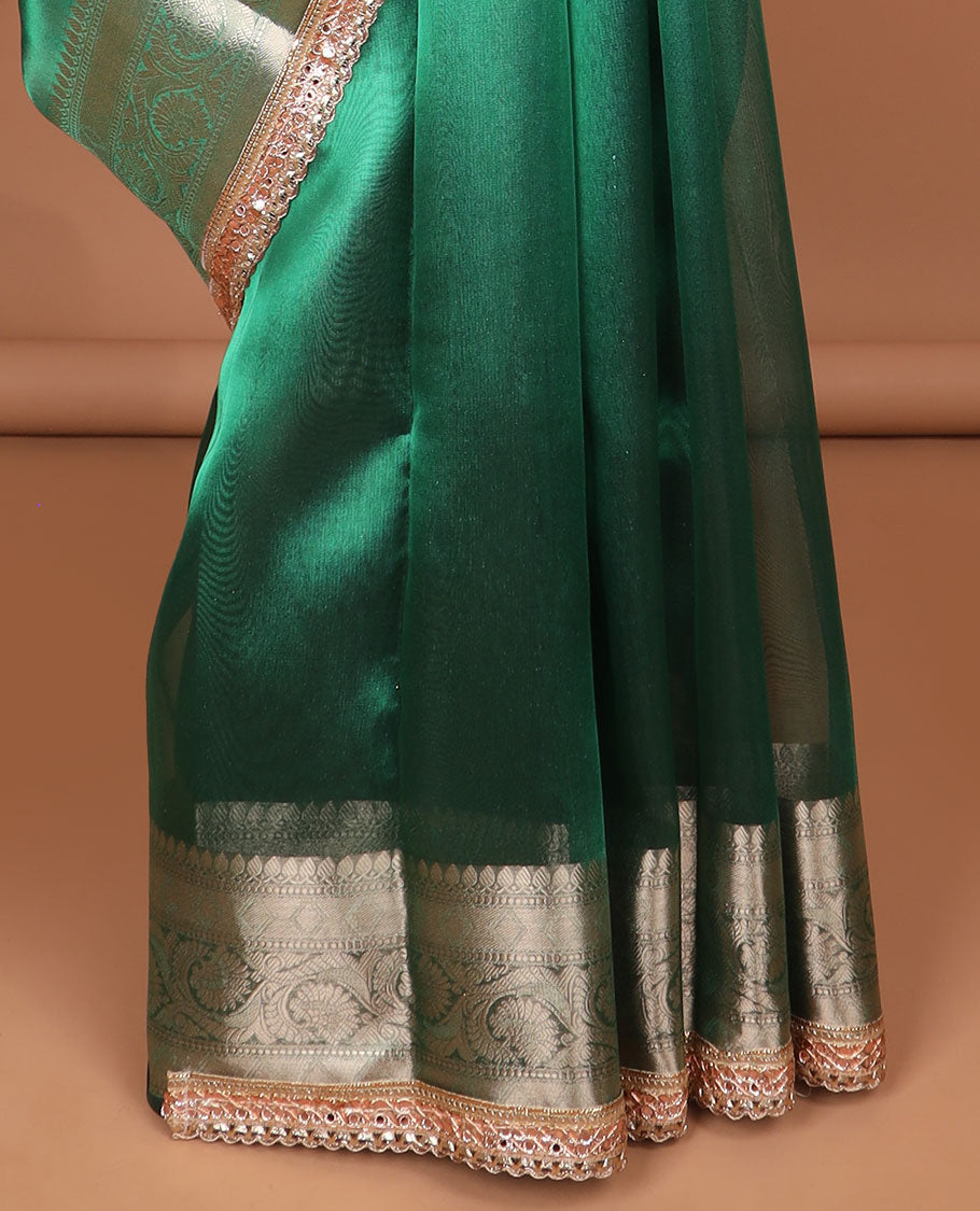 Dark green tissue saree with self zari design border & intricate zari design pallu