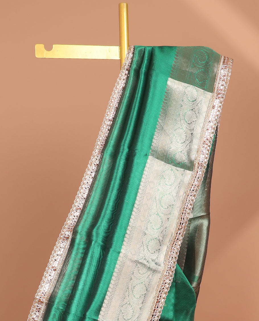 Dark green tissue saree with self zari design border & intricate zari design pallu